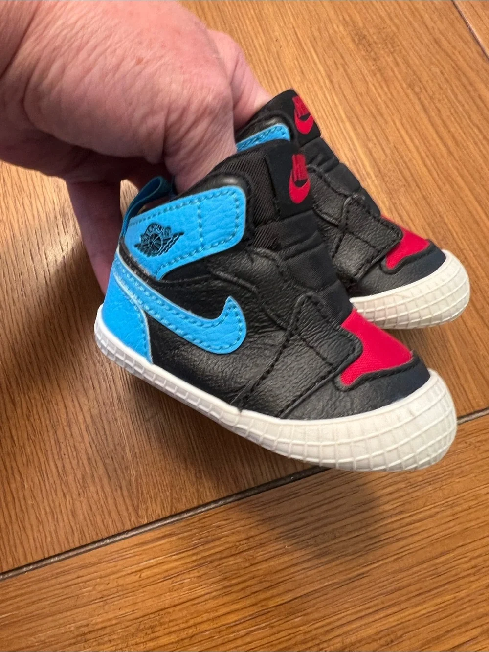 Nike Kids Black High-Top Sneakers with Blue and Red Accents